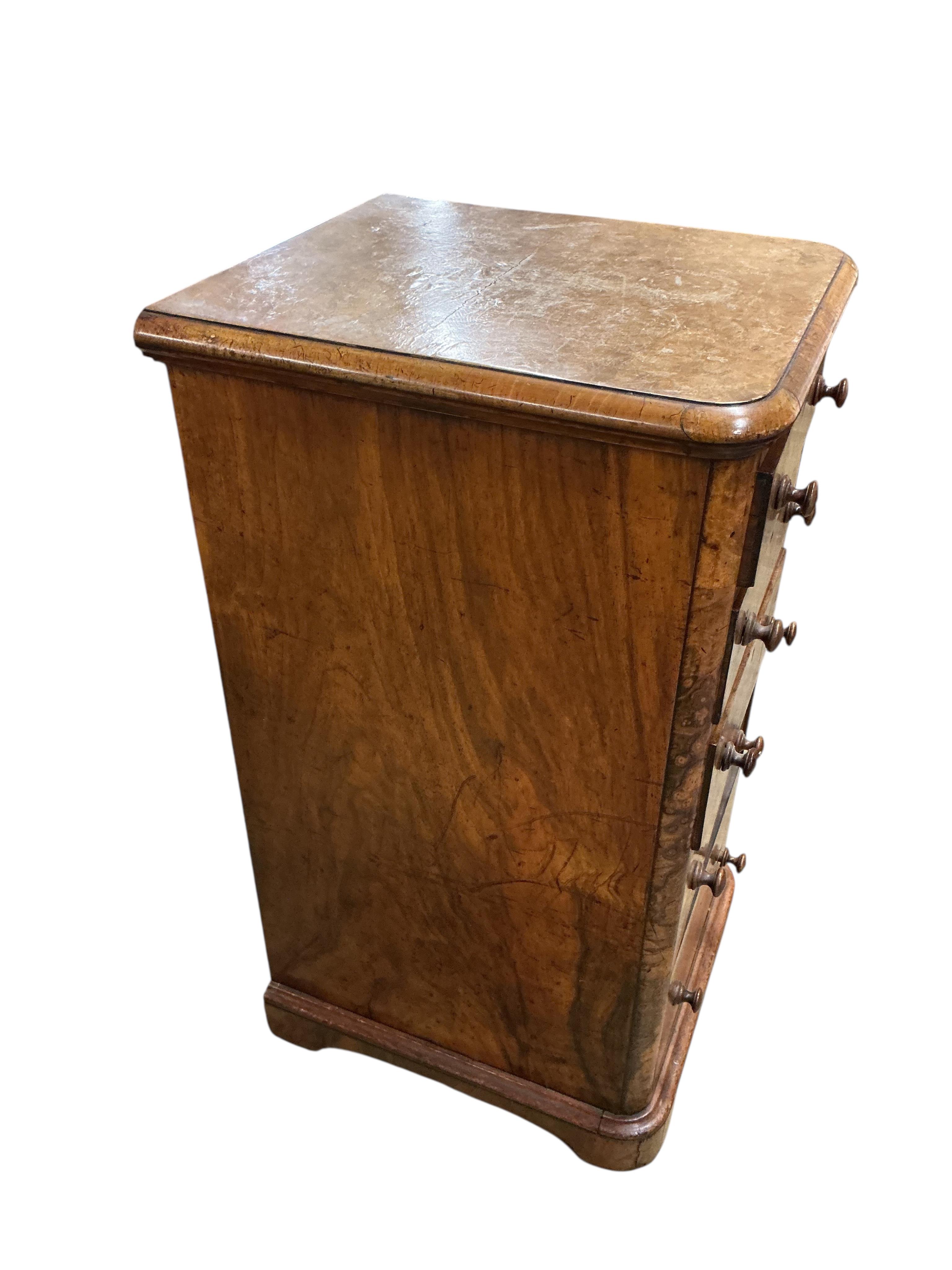 A pair of Victorian figured walnut five drawer bedside chests, adapted from a dressing table, width 43cm, depth 47cm, height 86cm